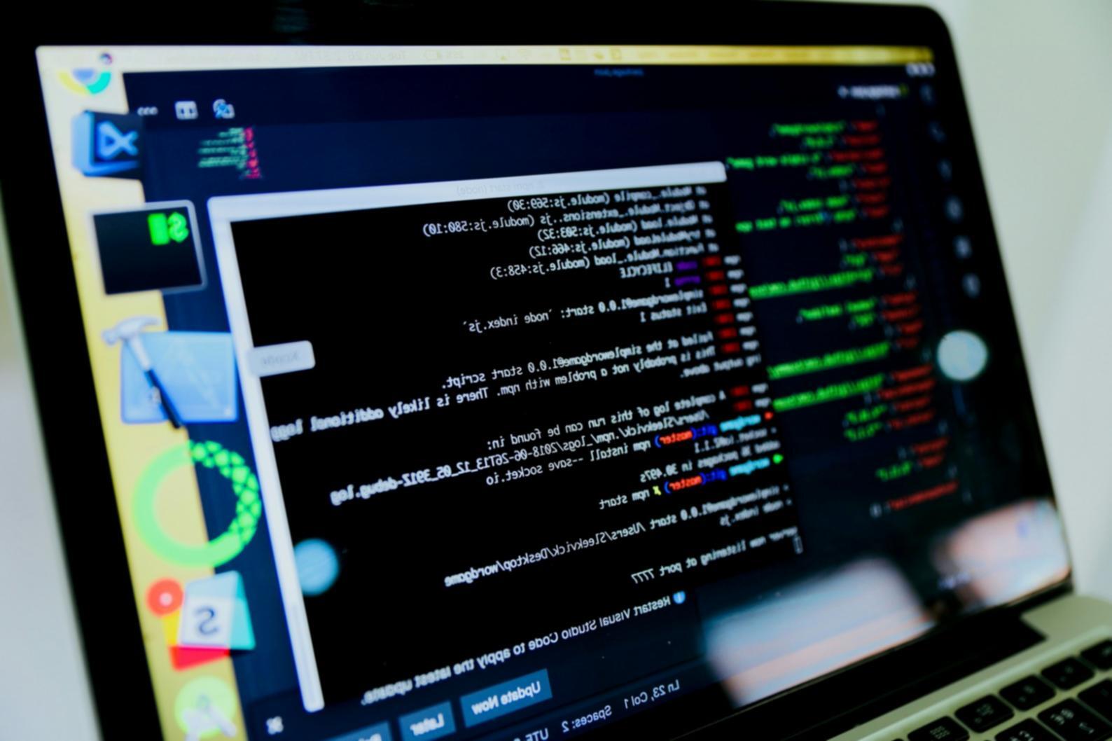 Students working on front-end development projects in a collaborative learning environment